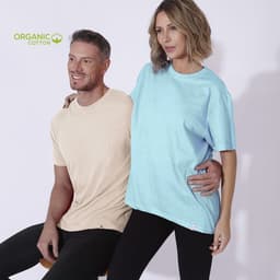 A light beige t-shirt and a sky blue t-shirt on two models. The image features a logo indicating organic cotton.