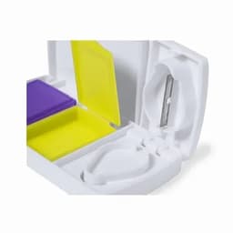 A compact white container with compartments for purple and yellow sections, featuring a small blade inside.
