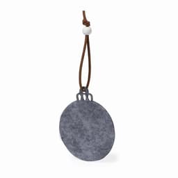 A round grey stone pendant with a leather strap, featuring a bead and decorative elements at the top.