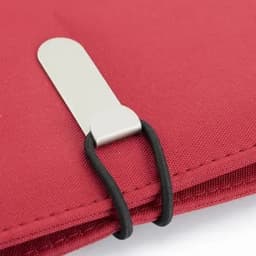 A red fabric product featuring a silver metal clip secured by a black elastic band.