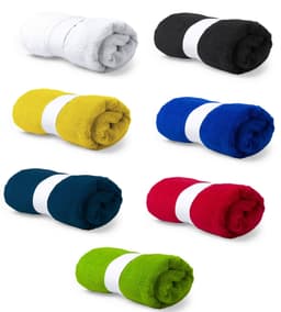 A set of rolled towels in white, black, yellow, blue, navy, red, and green, each secured with a white band.