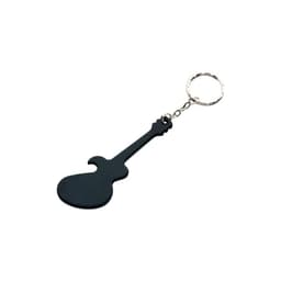 A drink bottle opener shaped like a black guitar, featuring a keychain attachment.