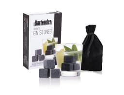 A set of six grey gin stones with a velvet bag and packaging, alongside a drink featuring mint and lime.