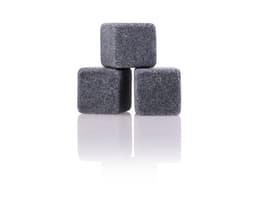 A set of three grey granite drink stones, designed for chilling beverages without dilution.