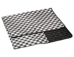 A large picnic rug featuring a black and white checkered pattern with a black quilted section. It has a logo.