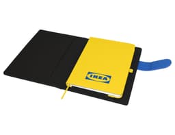 A yellow notebook with a logo inside a black portfolio, featuring a blue elastic band and bookmark.