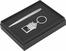 A silver pen, a metal keyring in the shape of a house, and a gift box with a black interior.