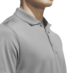A grey polo shirt with a collar, featuring a logo, displayed on a mannequin's upper body.