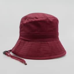 A maroon bucket hat with a chin strap, featuring a seamless brim and structured design.