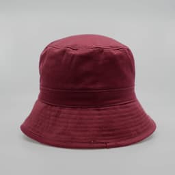 A maroon bucket hat featuring a rounded crown and a wide brim, with a logo on the side.
