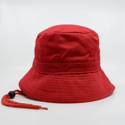 A red bucket hat featuring a textured brim and an adjustable drawstring. The hat includes a logo detail.