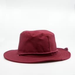 A wide-brim hat in burgundy with a braided cord band and a logo detail. Ideal for outdoor activities.