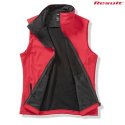 A red softshell vest with a black interior and a high collar, featuring a logo on the top right.
