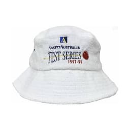 A white terry towelling bucket hat featuring a logo and text. The fabric has a soft, textured appearance.