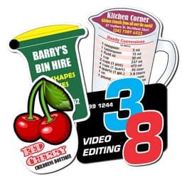 Custom-shaped fridge magnets in various colours, featuring a cherry, measuring jug, and business card designs, with logos.