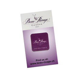 A purple microfibre sticky screen cleaner with a logo and branding. The packaging features a sleek design.
