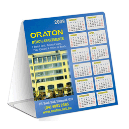 A table tent featuring a blue design, displaying a calendar for 2009 with a logo and an image of a building.