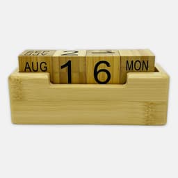 A bamboo perpetual calendar with wooden blocks displaying the date and month, housed in a rectangular base.