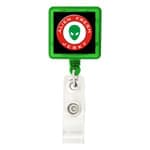 A green rectangular badge holder with a clear strap and a logo displayed in the centre.