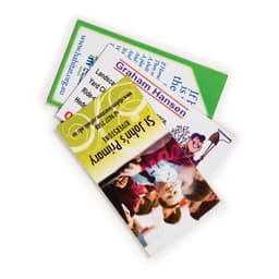 A stack of rectangular magnets in various colours, featuring different images and a logo on one magnet.