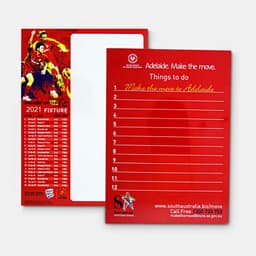 A red magnetic whiteboard featuring a blank writing surface and a list template on one side, with a logo.