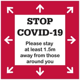 A floor decal sticker in red and white, featuring arrows and a message about maintaining social distance.