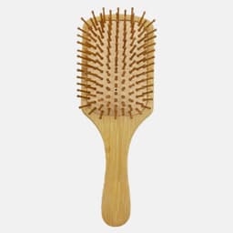 A bamboo hairbrush with a wooden handle and bristles, featuring a rectangular paddle design.
