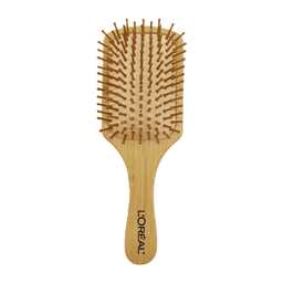 A bamboo hairbrush with a flat paddle design and rounded wooden bristles. Features a branding logo on the handle.