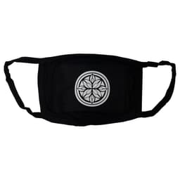 A black cotton face mask featuring a circular geometric design in the centre and ear straps for secure fitting.