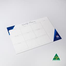 A magnetic whiteboard in white and blue, featuring a weekly planner layout with multiple sections.