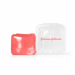 A red jelly cube sensory toy beside a transparent plastic case with a logo.