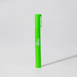 A green jumbo highlighter with a textured cap and a branding logo.