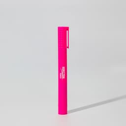 A bright pink jumbo highlighter with a textured grip and a clip, featuring a branding logo.