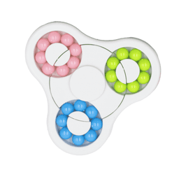 A colourful puzzle game featuring pink, blue, green, and yellow beads arranged in a circular design with a central section.