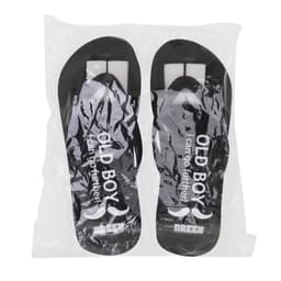 Black EVA classic thongs in protective packaging, featuring a logo and a simple design.