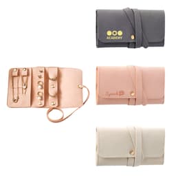 A synthetic leather jewellery bag displayed in pink, grey, and cream with gold accents and a logo.