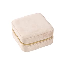 A square velvet jewellery organiser in a soft beige colour with a gold zipper.