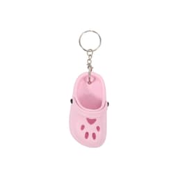 A pink paw-shaped clog shoe keyring with a metal keychain attachment.