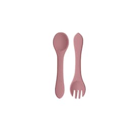 A set of classic silicone kids cutlery in a soft pink colour, including a spoon and a fork. The utensils have a smooth design and are flexible.
