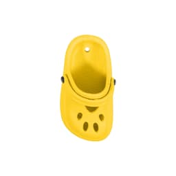 A bright yellow clog shoe charm with ventilation holes and a rounded shape, featuring a black button detail.