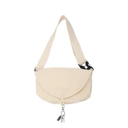 A cream-coloured casual crossbody bag with a flap closure and an adjustable strap, featuring a logo.