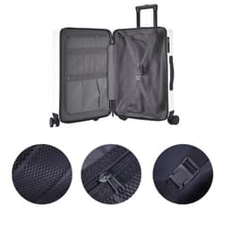 An ABS business suitcase in white with an open interior, featuring black compartments, zippers, and a wheeled base.