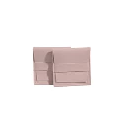 Two pale pink PU leather flip jewelry pouches with a simple design and a front pocket.