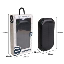 A black outdoor solar wireless power bank with green accents, displayed in its packaging.