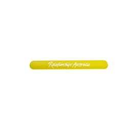 A yellow silicone slap band with a logo, featuring a smooth, flexible design ideal for promotional events.
