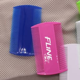 A pink and blue pet flea comb with a branded logo, featuring fine and wide teeth for grooming.