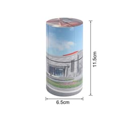 A cylindrical puzzle with a colourful design, measuring 6.5 cm by 11.5 cm, featuring a scenic architectural image.