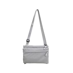 A lightweight crossbody bag in grey with adjustable strap and multiple zippered compartments. It features a logo.