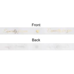 A transparent organza ribbon, featuring gold text on both sides that reads "Especially for you."