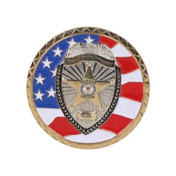 A commemorative gold coin pin featuring a shield design, accented with red, white, and blue elements, and a logo.